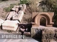Video of different ornamental pieces and broken khatchkars lined up on the walls.